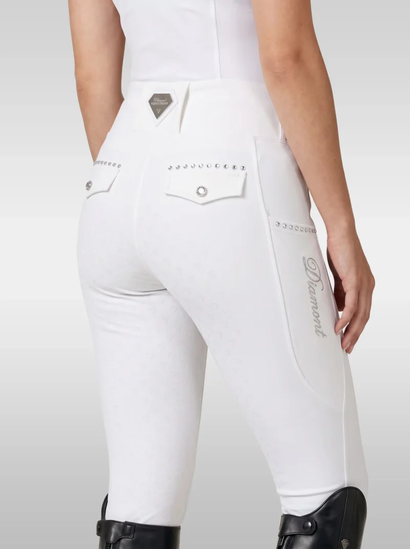 Back three-quarter view of white competition breeches with Diamont Equestrian waistband badge, crystal-trimmed back pockets and Diamont script