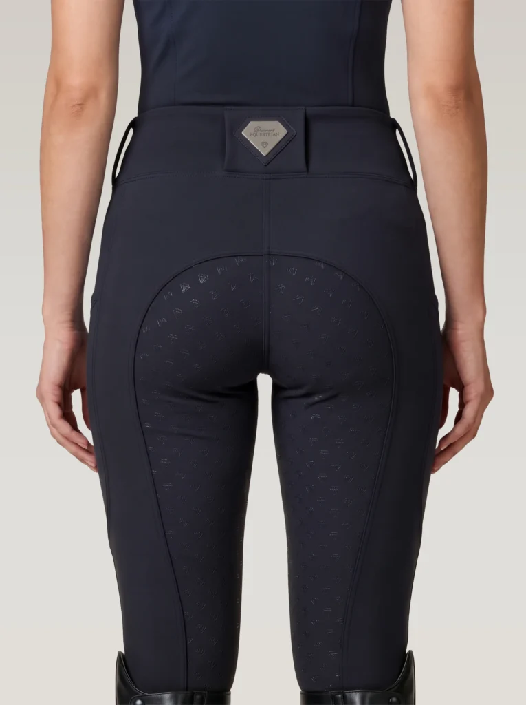 Back view of black Prestige riding leggings with Diamont Equestrian metal waistband badge and full-seat silicone grip