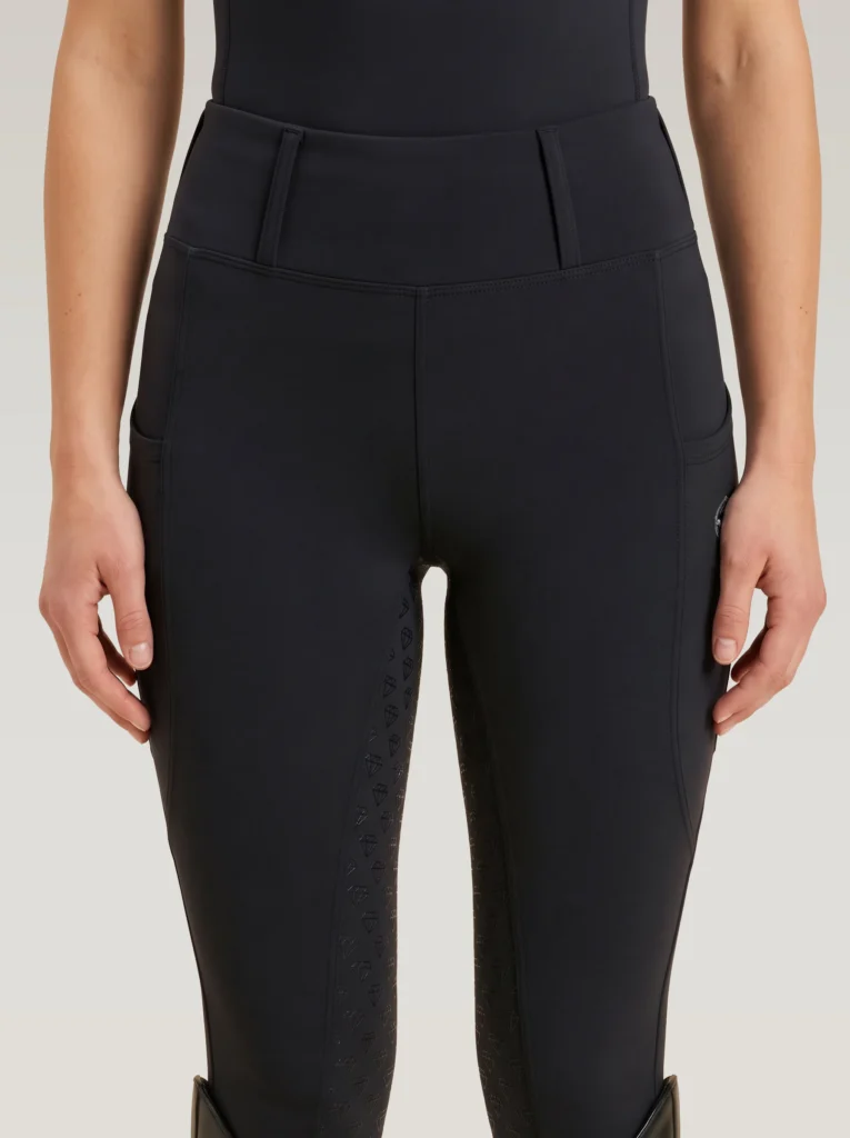 Front view of black Prestige riding leggings by Diamont Equestrian with high-rise waistband and belt loops