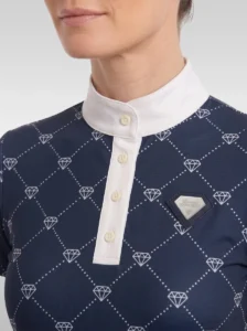 Close-up of the navy Diamont base layer: white stand-up collar, button placket, diamond monogram print and silver metal diamond badge