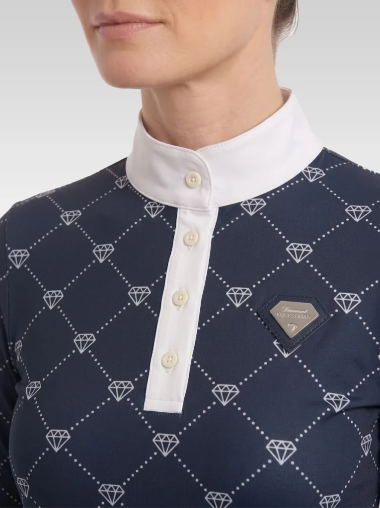 Close-up of the navy Diamont long sleeve base layer: white stand-up collar, button placket, diamond monogram print and silver metal diamond badge