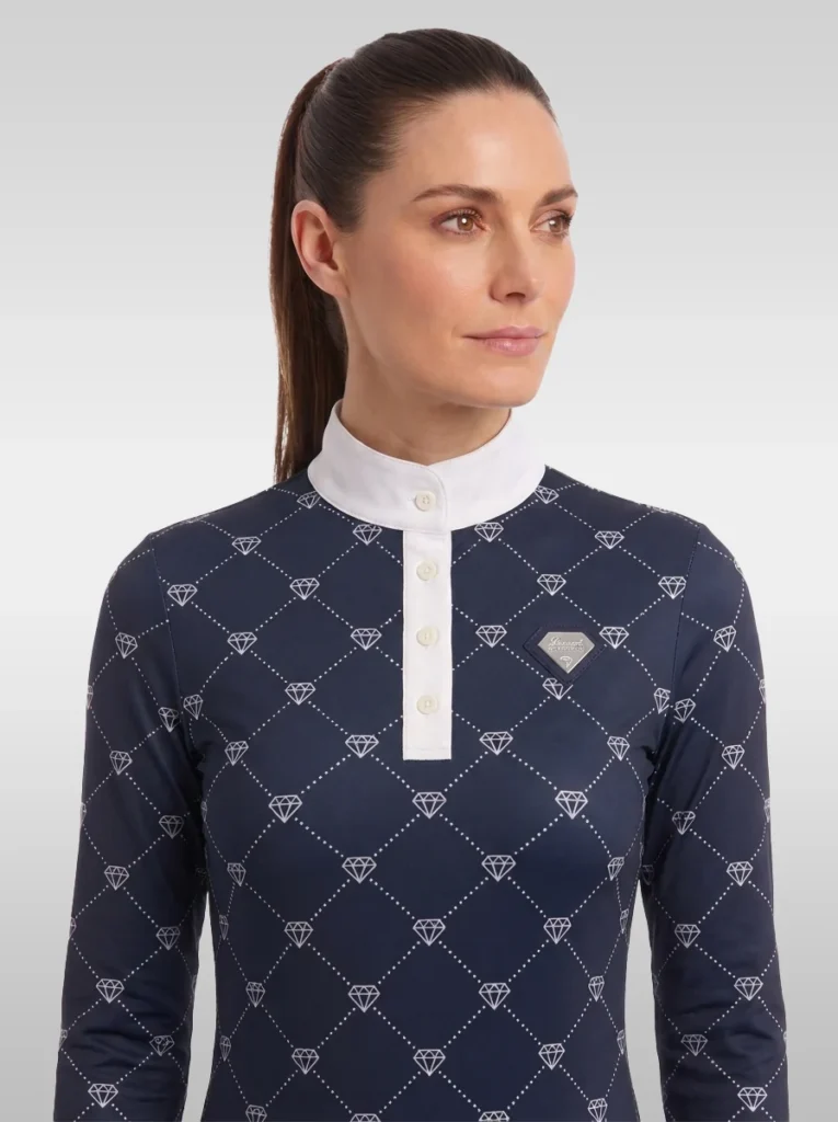 Front view of the navy Diamont long sleeve equestrian base layer with white buttoned placket, stand-up collar and silver diamond badge