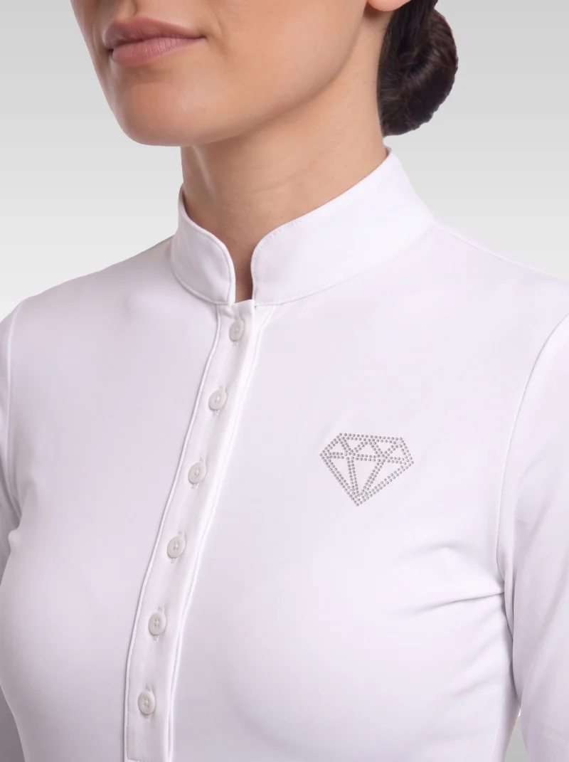 Close-up of the white competition shirt: stand-up collar, covered button placket and rhinestone diamond logo on the chest