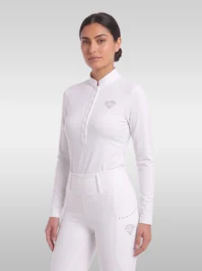 White Elite Competition long sleeve base layer by Diamont Equestrian with stand-up collar, button placket and rhinestone diamond logo, front three-quarter view