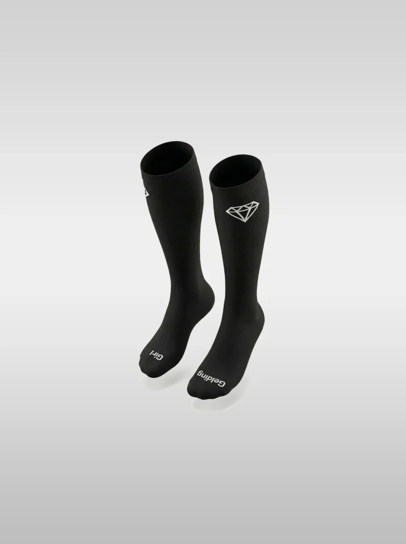 Black Diamont Equestrian EquiChic knee-high riding socks with the "Gelding Girl" phrase on the sole and diamond logo at the top