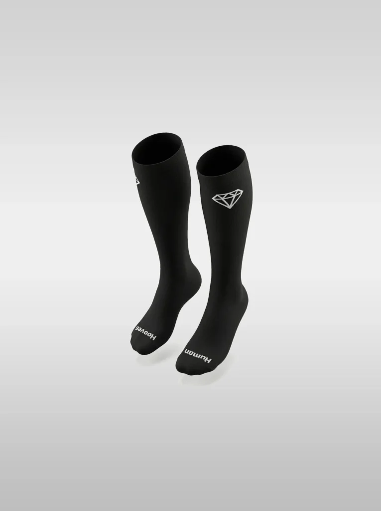 Black Diamont Equestrian EquiChic knee-high riding socks with the "Human Hooves" phrase on the sole and diamond logo at the top