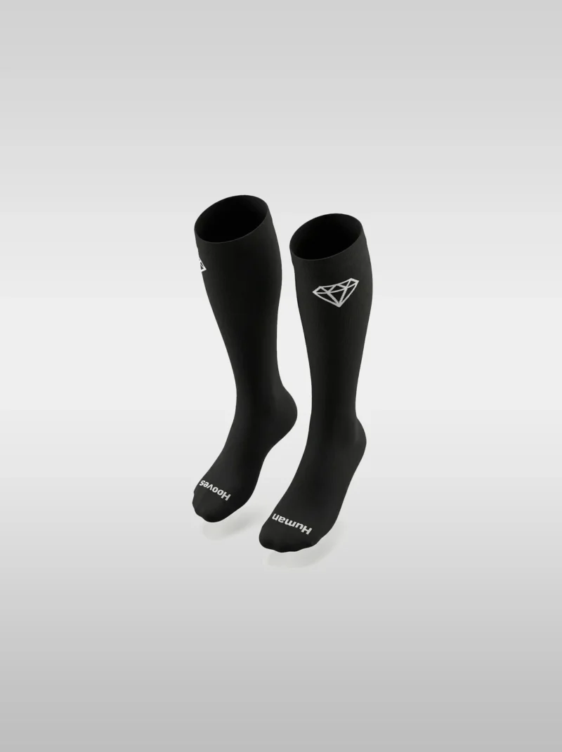 Black Diamont Equestrian EquiChic knee-high riding socks with the "Human Hooves" phrase on the sole and diamond logo at the top