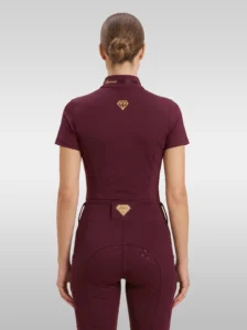 Back view of the burgundy Prestige riding shirt with gold diamond logo between the shoulders and Diamont lettering on the collar