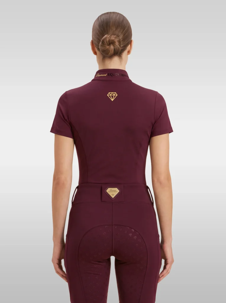 Back view of the burgundy Prestige riding shirt with gold diamond logo between the shoulders and Diamont lettering on the collar