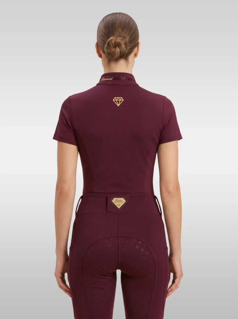 Back view of the burgundy Prestige riding shirt with gold diamond logo between the shoulders and Diamont lettering on the collar