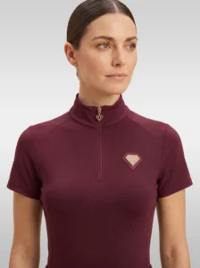 Front view of the burgundy Prestige base layer by Diamont Equestrian with high collar, gold zip and diamond badge