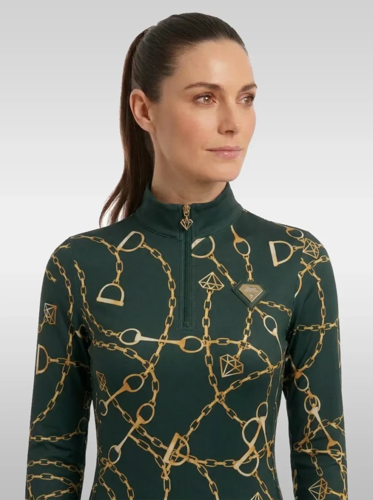 Front view of the green Signature long sleeve equestrian base layer with stand-up collar, gold zip and gold diamond badge