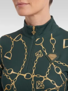 Close-up of the green Signature long sleeve base layer: stand-up collar, quarter-zip with gold diamond pull, chain and stirrup print and gold metal diamond badge