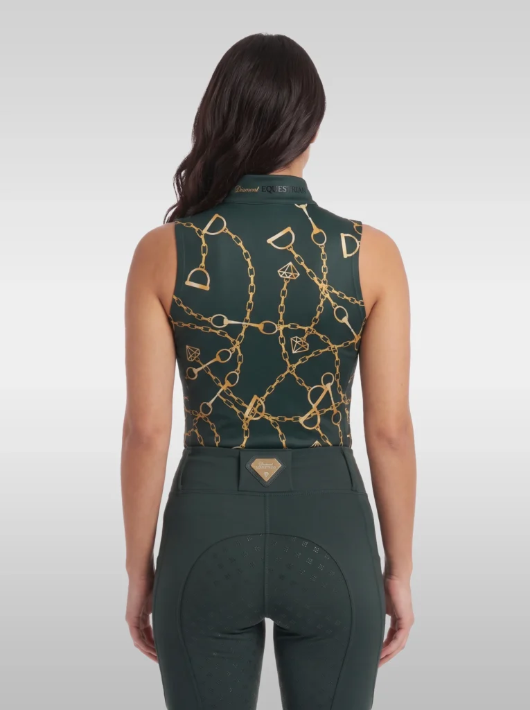 Back view of the green Signature sleeveless riding top with all-over gold chain, bit and stirrup print