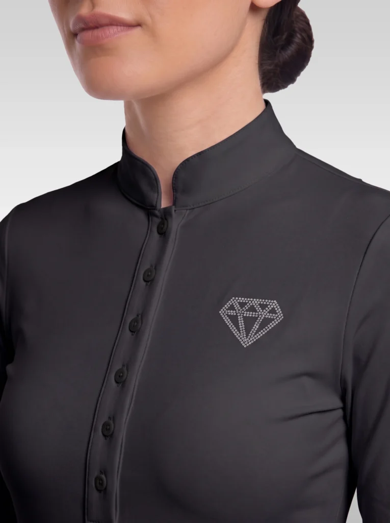 Close-up of the black competition shirt: stand-up collar, button placket and rhinestone diamond logo on the chest