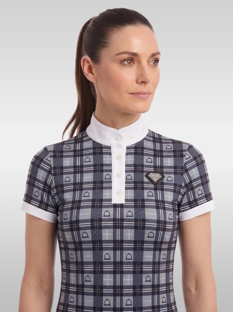 Front view of the grey Heritage check equestrian base layer with white buttoned placket, stand-up collar and silver diamond badge