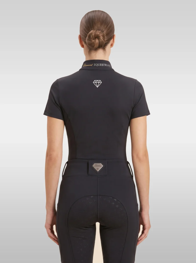 Back view of the black Prestige riding shirt with diamond logo between the shoulders and Diamont Equestrian lettering on the collar