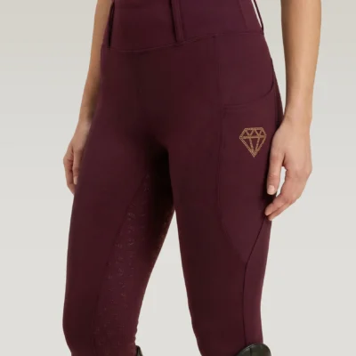 Burgundy Prestige riding leggings by Diamont Equestrian with diamond logo on the side pocket and diamond silicone grip, front three-quarter view