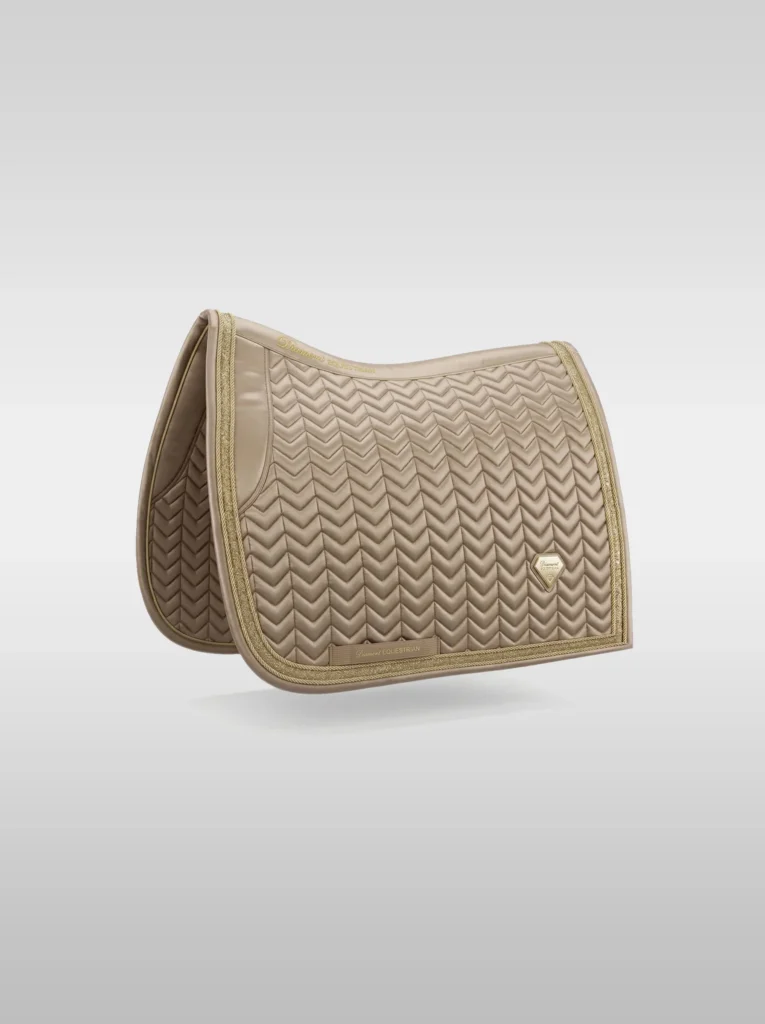 Beige Prestige dressage saddle pad by Diamont Equestrian with chevron quilting, contrast piping and a metal diamond badge