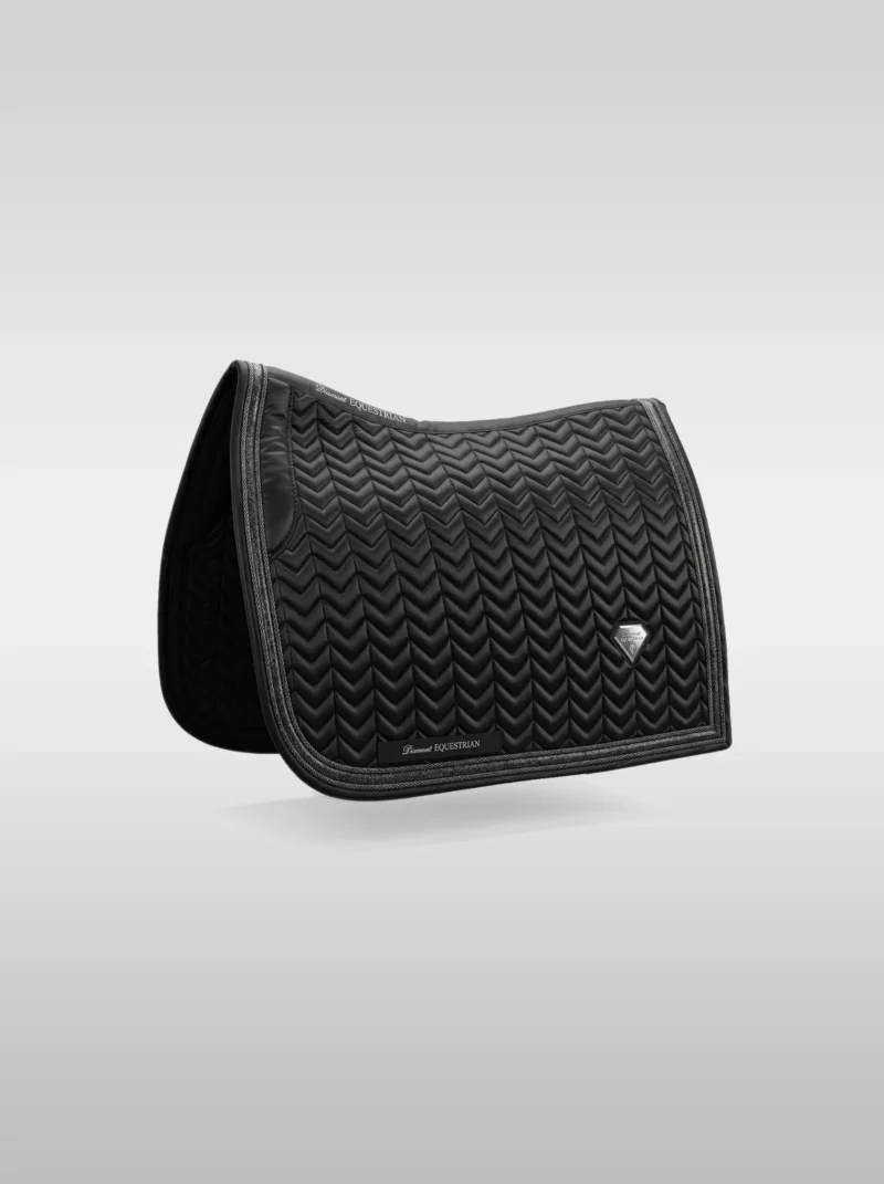 Black Prestige dressage saddle pad by Diamont Equestrian with chevron quilting, contrast piping and a metal diamond badge