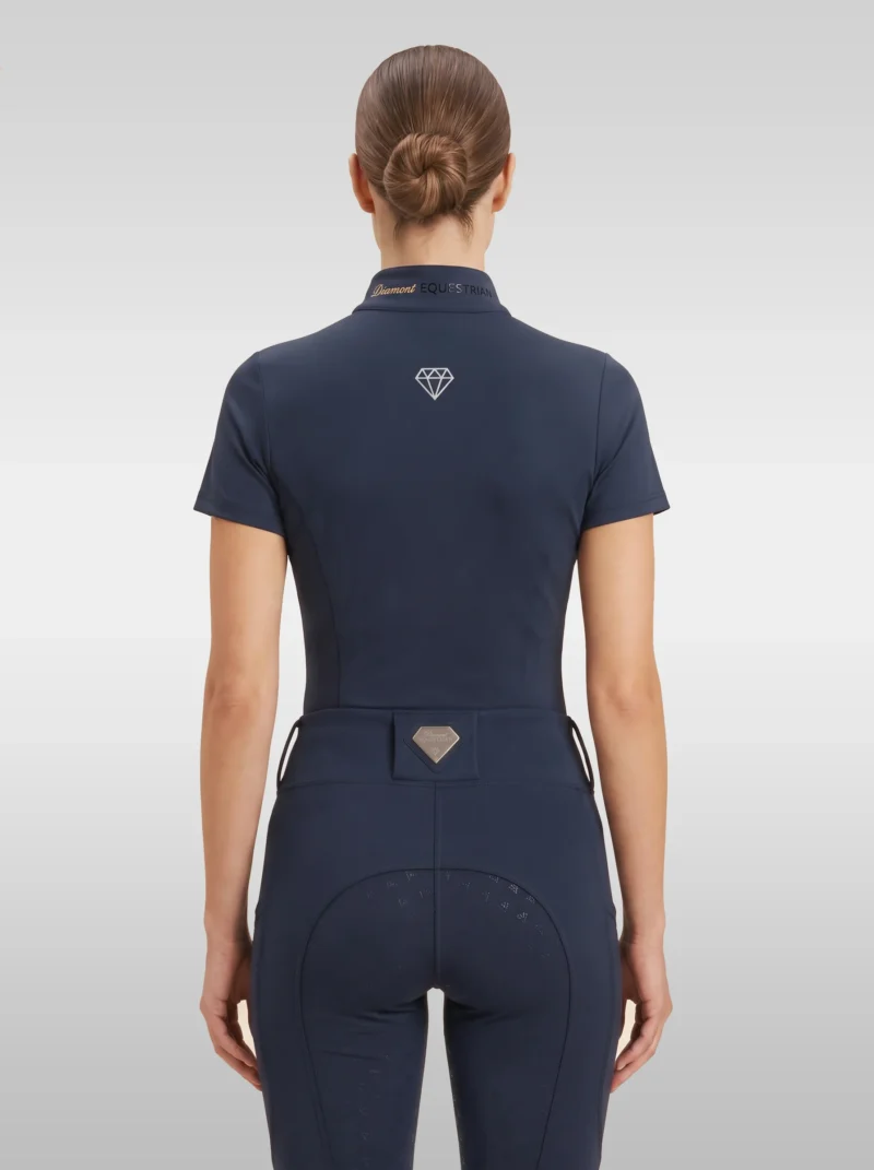Back view of the navy Prestige riding shirt with diamond logo between the shoulders and Diamont lettering on the collar