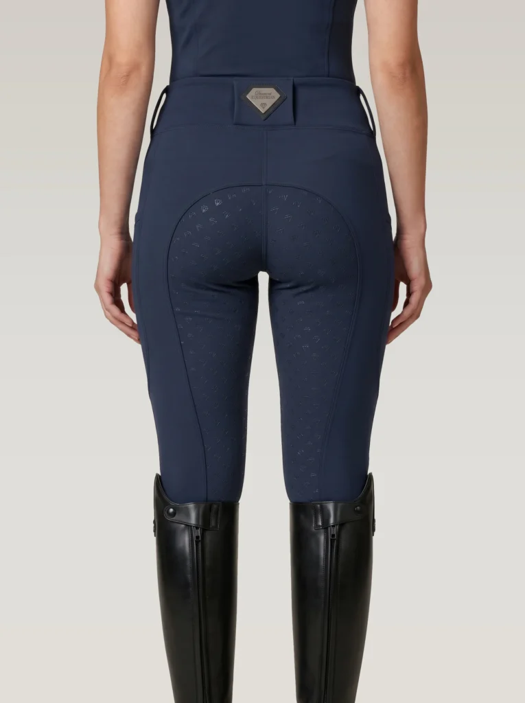 Back view of navy Prestige riding leggings with Diamont Equestrian waistband badge and full-seat silicone grip