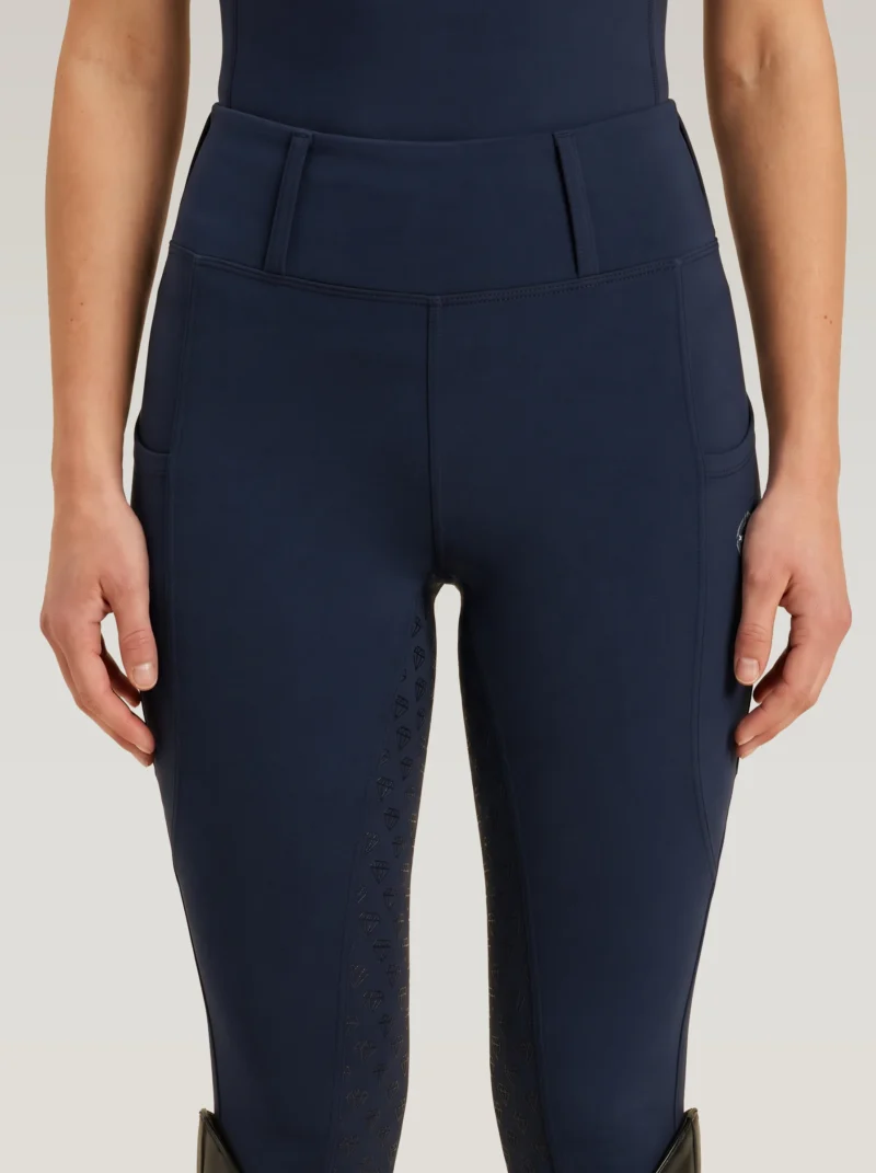 Front view of navy Prestige riding leggings by Diamont Equestrian with high-rise waistband and belt loops