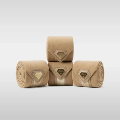 Set of four beige Prestige fleece polo wraps by Diamont Equestrian with a metal diamond badge in a leather frame