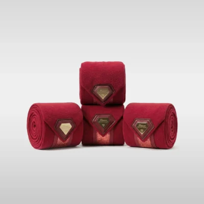 Set of four burgundy Prestige fleece polo wraps by Diamont Equestrian with a metal diamond badge in a leather frame