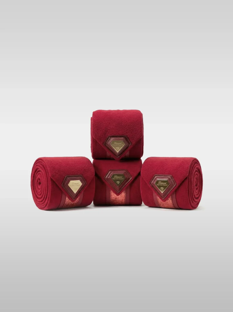 Set of four burgundy Prestige fleece polo wraps by Diamont Equestrian with a metal diamond badge in a leather frame