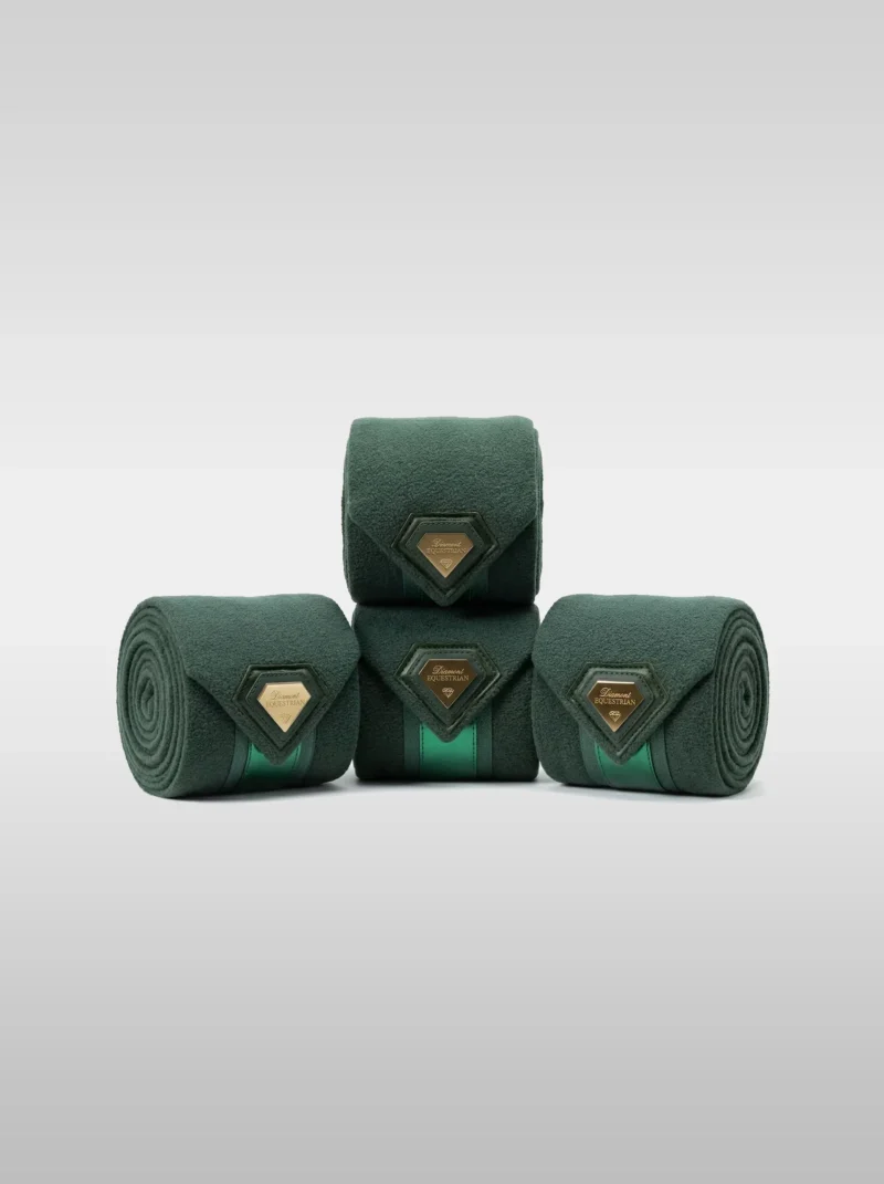 Set of four green Prestige fleece polo wraps by Diamont Equestrian with a metal diamond badge in a leather frame