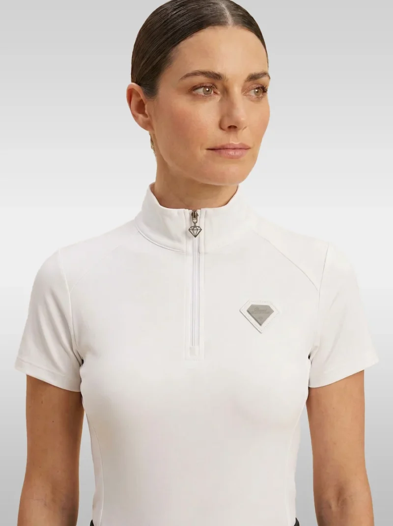 Front view of the white Prestige base layer by Diamont Equestrian with high collar, silver zip and diamond badge