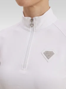Close-up of the white Prestige base layer: silver zip with diamond pull and silver metal Diamont Equestrian badge in a white leather frame