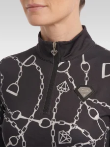 Close-up of the black Signature long sleeve base layer: stand-up collar, quarter-zip with diamond pull, chain and stirrup print and silver metal diamond badge