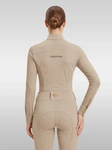 Back view of the beige Prestige long sleeve riding shirt with Equestrian lettering across the shoulders