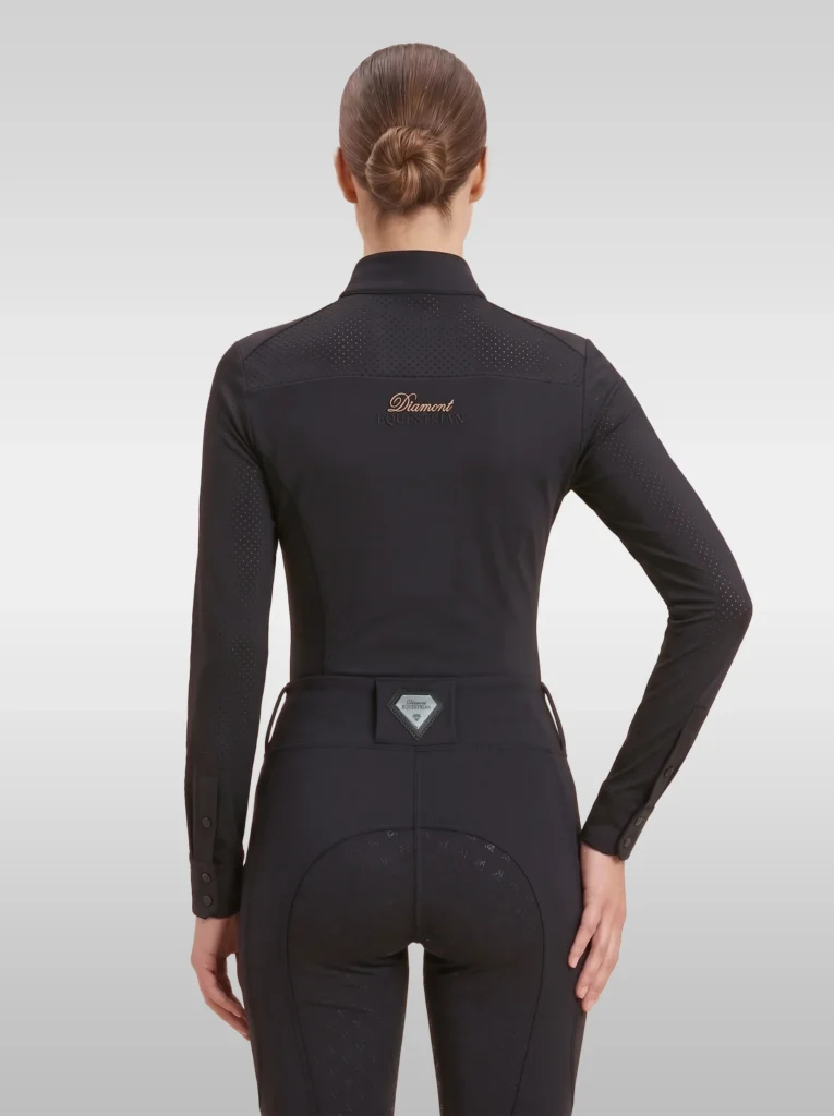 Back view of the black Prestige long sleeve riding shirt with Diamont script across the shoulders