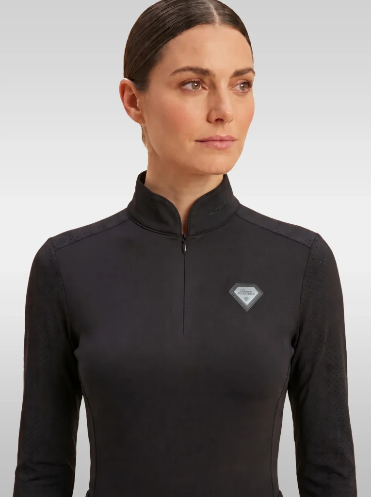 Front view of the black Prestige long sleeve base layer by Diamont Equestrian with high collar, zip and silver diamond badge