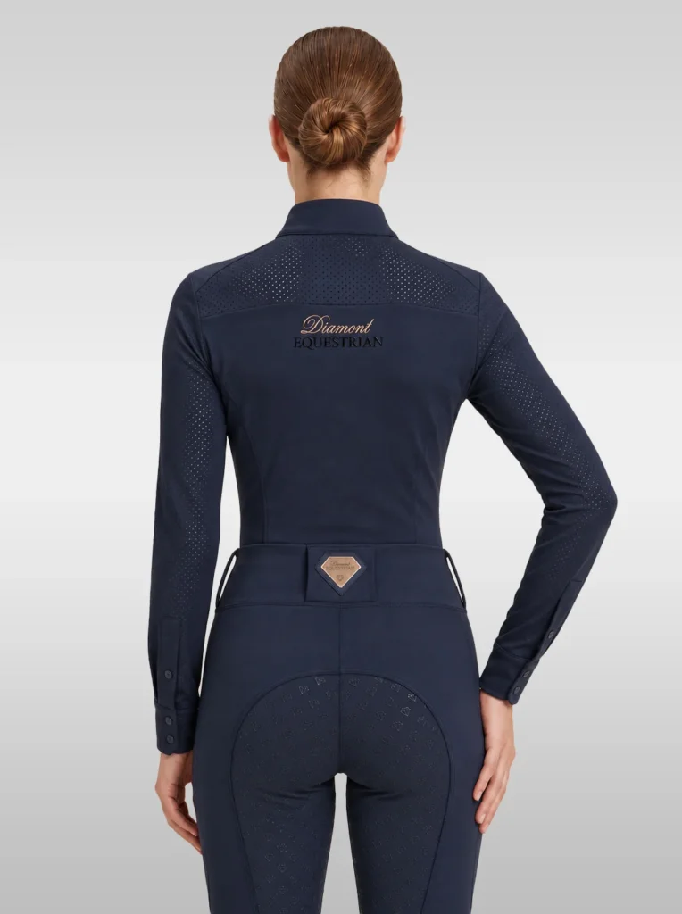 Back view of the navy Prestige long sleeve riding shirt with Diamont script across the shoulders
