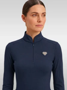 Front view of the navy Prestige long sleeve base layer by Diamont Equestrian with high collar, zip and silver diamond badge