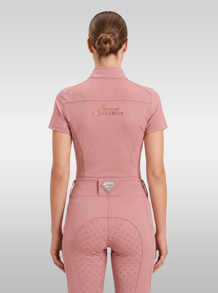 Back view of the blush pink Allure riding shirt with Diamont Equestrian lettering across the shoulders