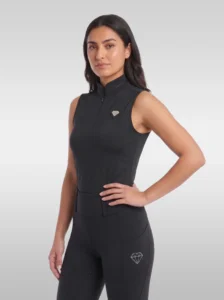 Black Prestige sleeveless base layer by Diamont Equestrian with stand-up collar, quarter-zip and silver metal diamond badge, front three-quarter view