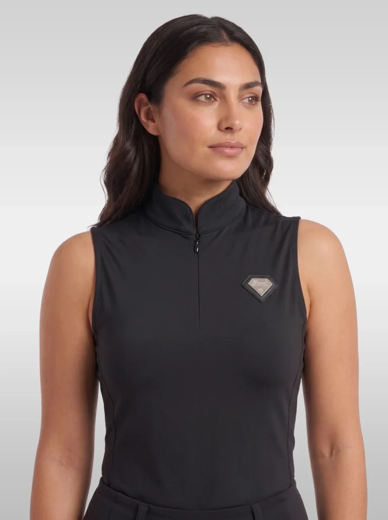 Front view of the black Prestige sleeveless equestrian base layer with high collar, zip and silver diamond badge