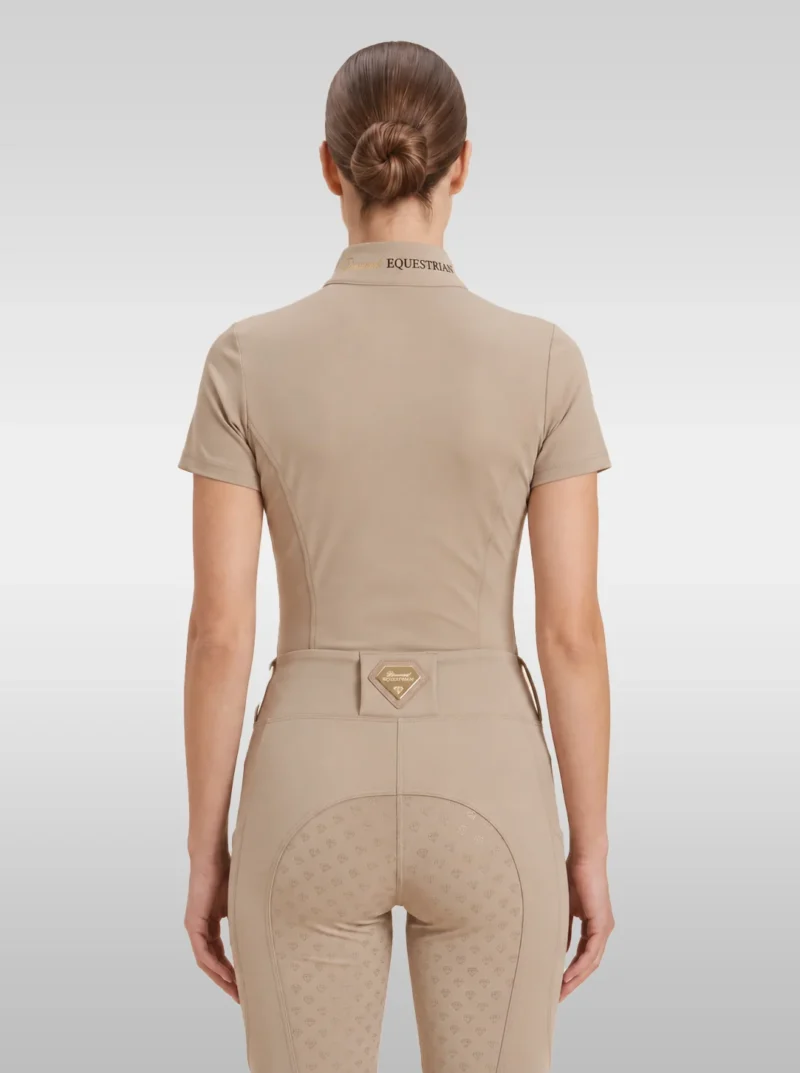 Back view of the beige Prestige riding shirt with Equestrian lettering on the collar