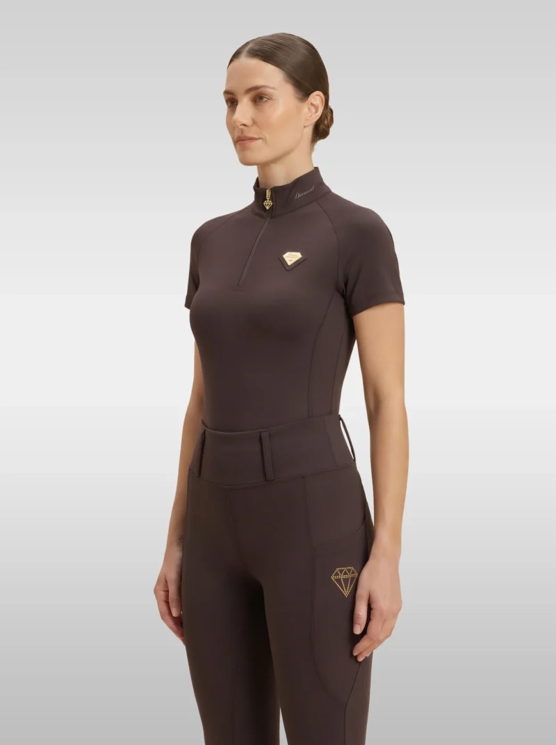 Chocolate brown Prestige base layer by Diamont Equestrian with gold quarter-zip and gold metal diamond badge on the chest, front three-quarter view
