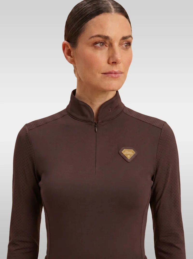 Front view of the chocolate brown Prestige long sleeve base layer by Diamont Equestrian with high collar, zip and gold diamond badge