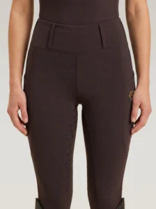 Front view of chocolate Prestige riding leggings by Diamont Equestrian with high-rise waistband and belt loops