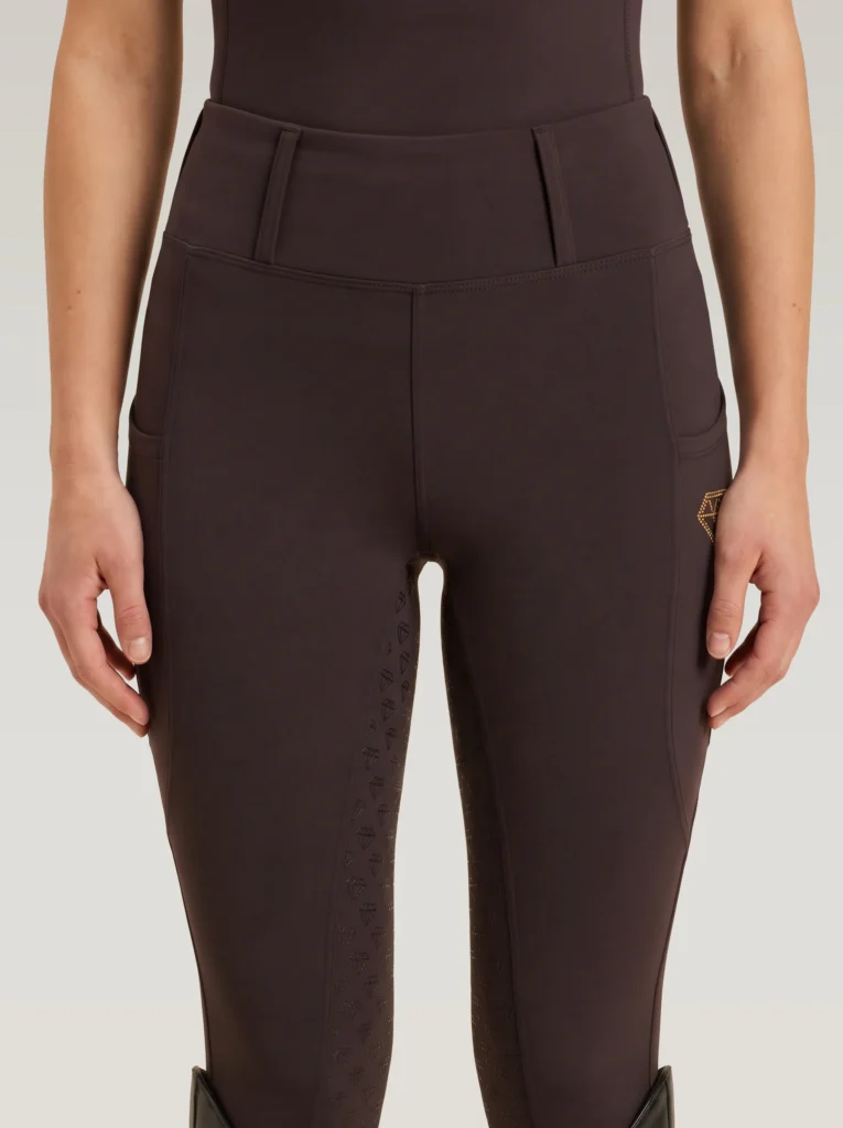 Front view of chocolate Prestige riding leggings by Diamont Equestrian with high-rise waistband and belt loops