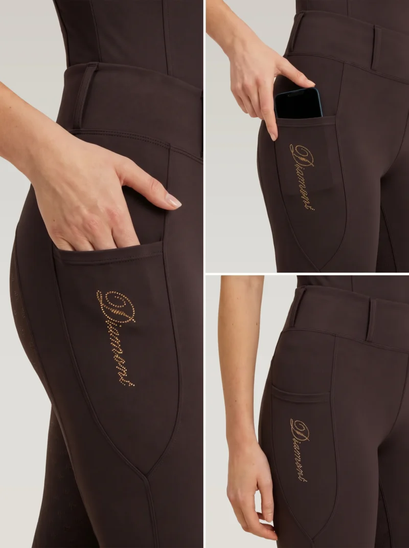 Close-up details of chocolate riding leggings: side phone pocket holding a smartphone and gold Diamont script