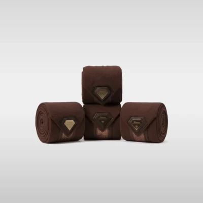 Set of four chocolate Prestige fleece polo wraps by Diamont Equestrian with a metal diamond badge in a leather frame