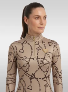 Front view of the beige Signature long sleeve equestrian base layer with stand-up collar, gold zip and gold diamond badge